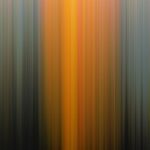 Vertical lines of blended colors, primarily orange, yellow, and blue, creating a gradient effect with a dark base.