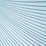 Diagonal blue and white lines create a geometric pattern on a light background, forming a dynamic visual effect.