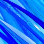Blue glass strands in varying shades of blue, with some translucent areas creating depth and texture.
