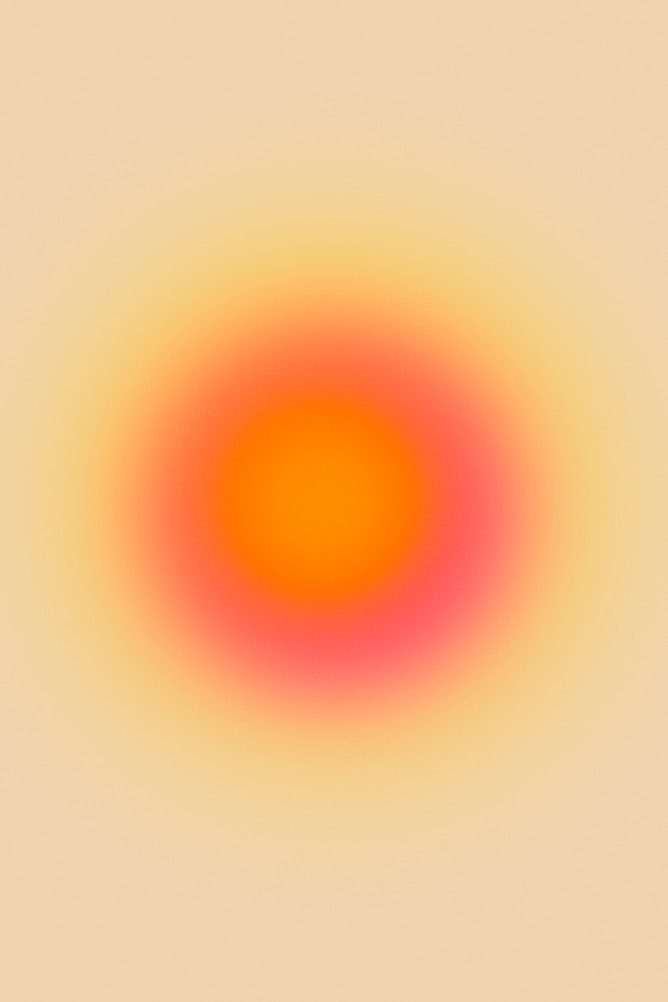 Circular gradient with a bright orange center, surrounded by shades of pink and soft yellow, set against a light beige background.