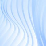 Wavy, translucent white patterns against a light blue background, creating a smooth and flowing texture.