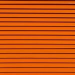 Horizontal lines of varying thickness in a bright orange color, creating a textured, striped pattern.
